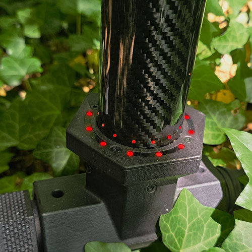 Close-up of a carbon fiber probe with LED orbit that shows red signals